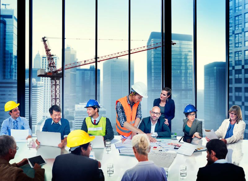 construction workers in boardroom cm