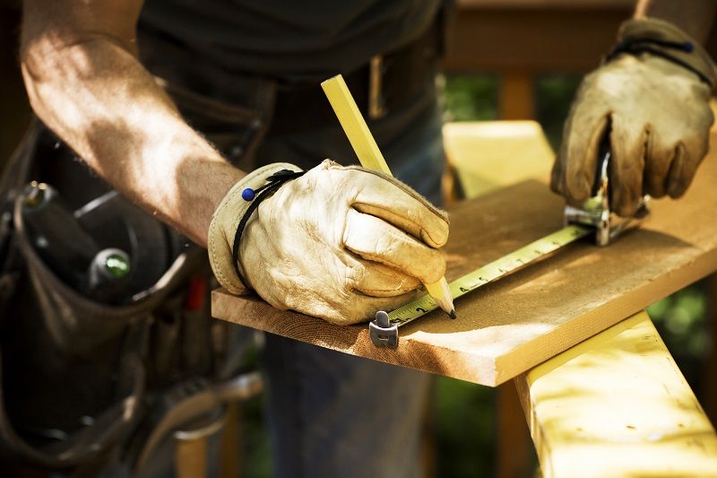 Carpenter Measuring A Wooden Plank. cm