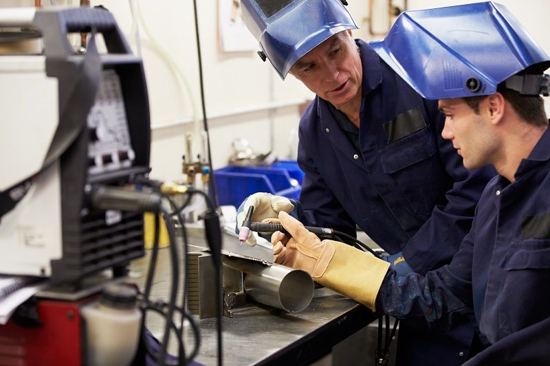 Engineer Teaching Apprentice To Use TIG Welding Machine cm