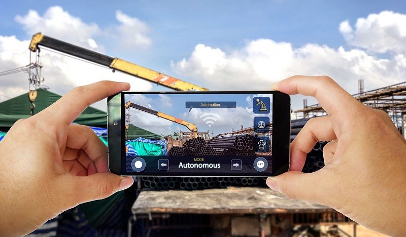 Industrial-4.0-IOT-concept,-Man-control-autonomous-truck-crane-cm