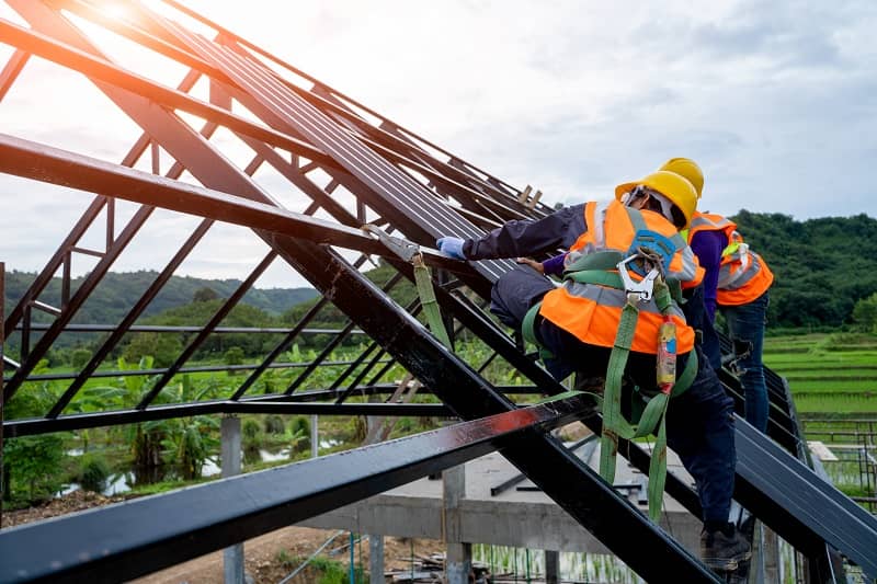 Roofer worker in protective uniform wear and gloves-cm