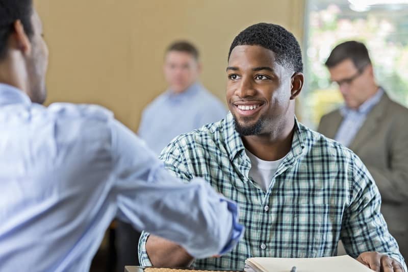 Handsome young African American man at job interview-cm