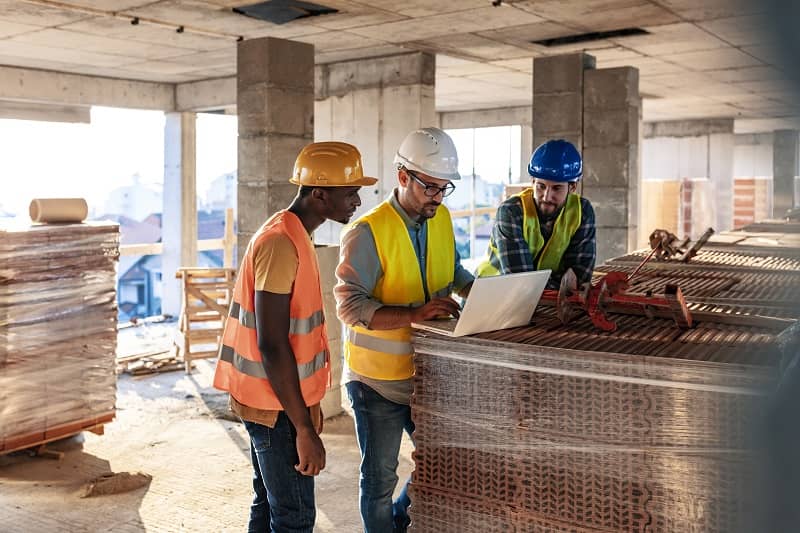 Workers at construction job site inside building-cm