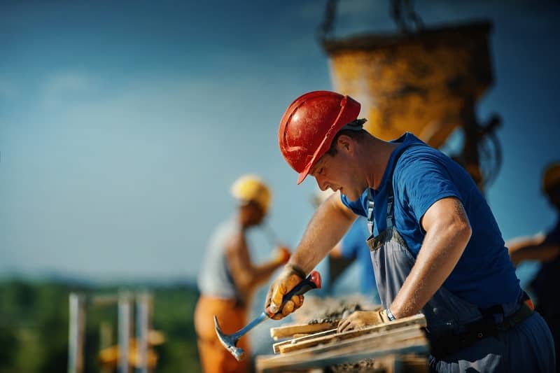 Construction worker on top of a building.-cm