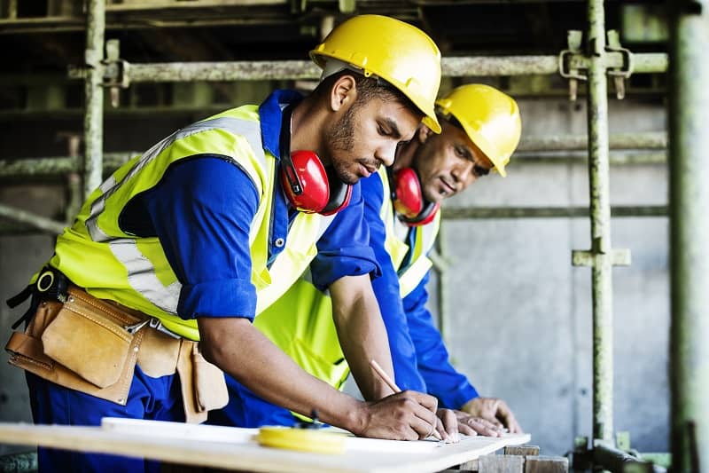 Workers working at construction site-cm