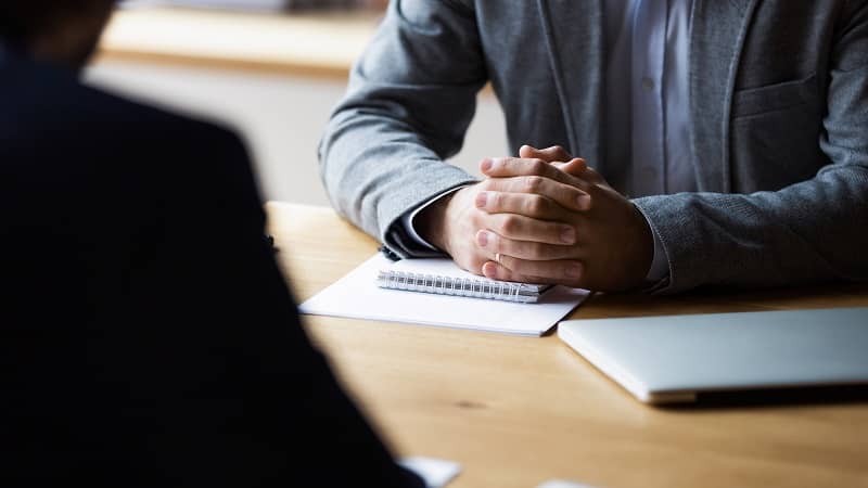 Close up focus on clasped hands of male entrepreneur-cm