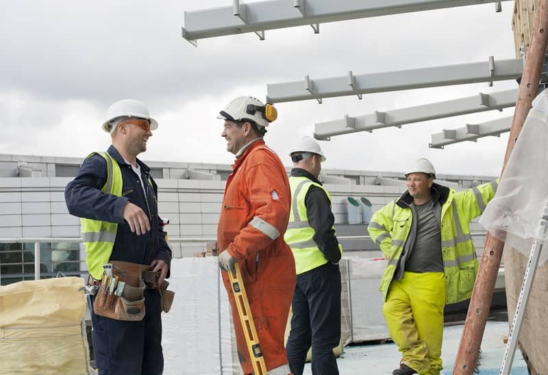 Construction workers in discussion-cm